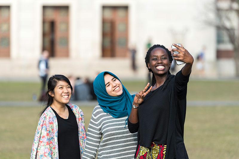 Students taking a selfi on campus